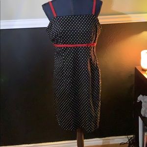 Black dress with white polkadots and red trim